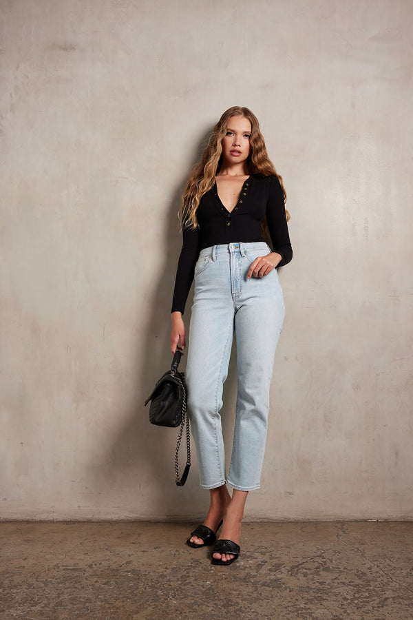 Woman wearing the Ambitionist Button Up Ribbed Henley Bodysuit in black