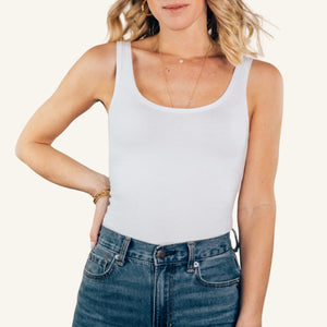 Woman wearing the Ambitionist Everyday Classic Tank Bodysuit in black cotton